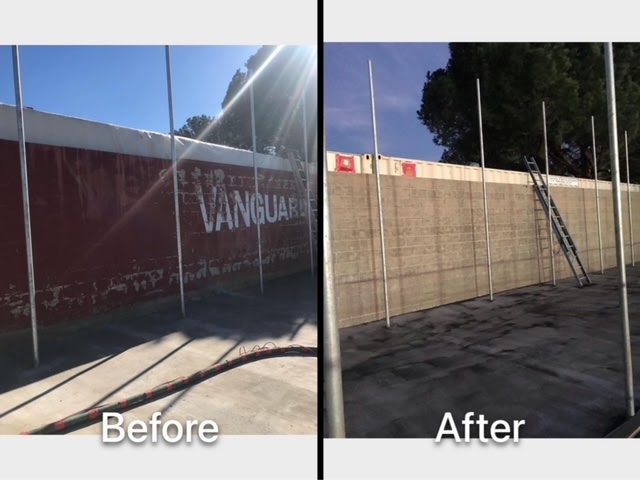 Before and after: a tall red-painted perimeter wall with lettering on the left and bare concrete block after paint removal on the right.